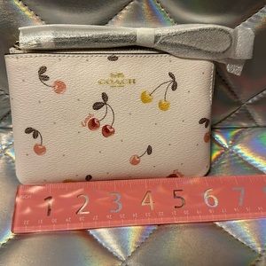 Coach wristlet with cherry print